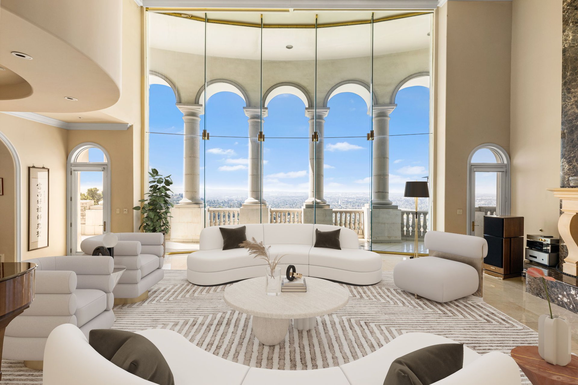 Luxury living room with curved white sofas and arched windows overlooking the city.